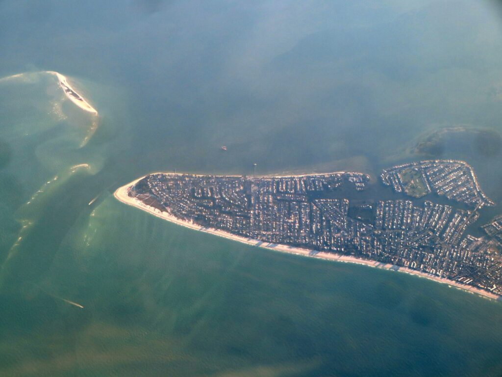 Aerial view of the north end of Anna Maria Island with its sandy shoreline and shallow water