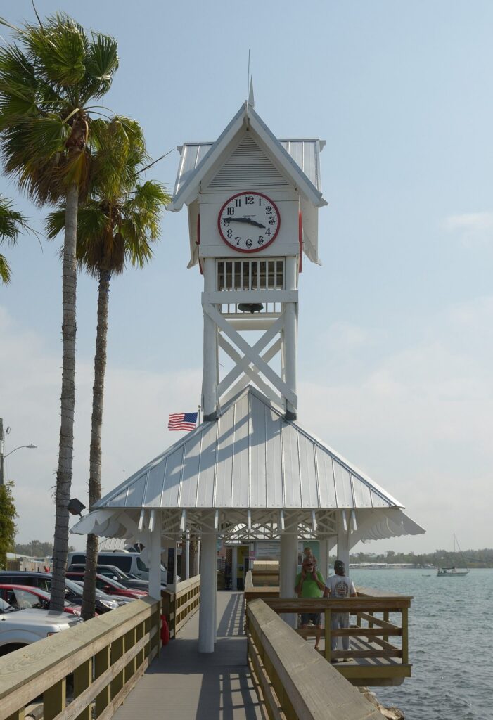 Clock tower and wooden walkway of the pier in Bradenton Beach, Anna Maria Island