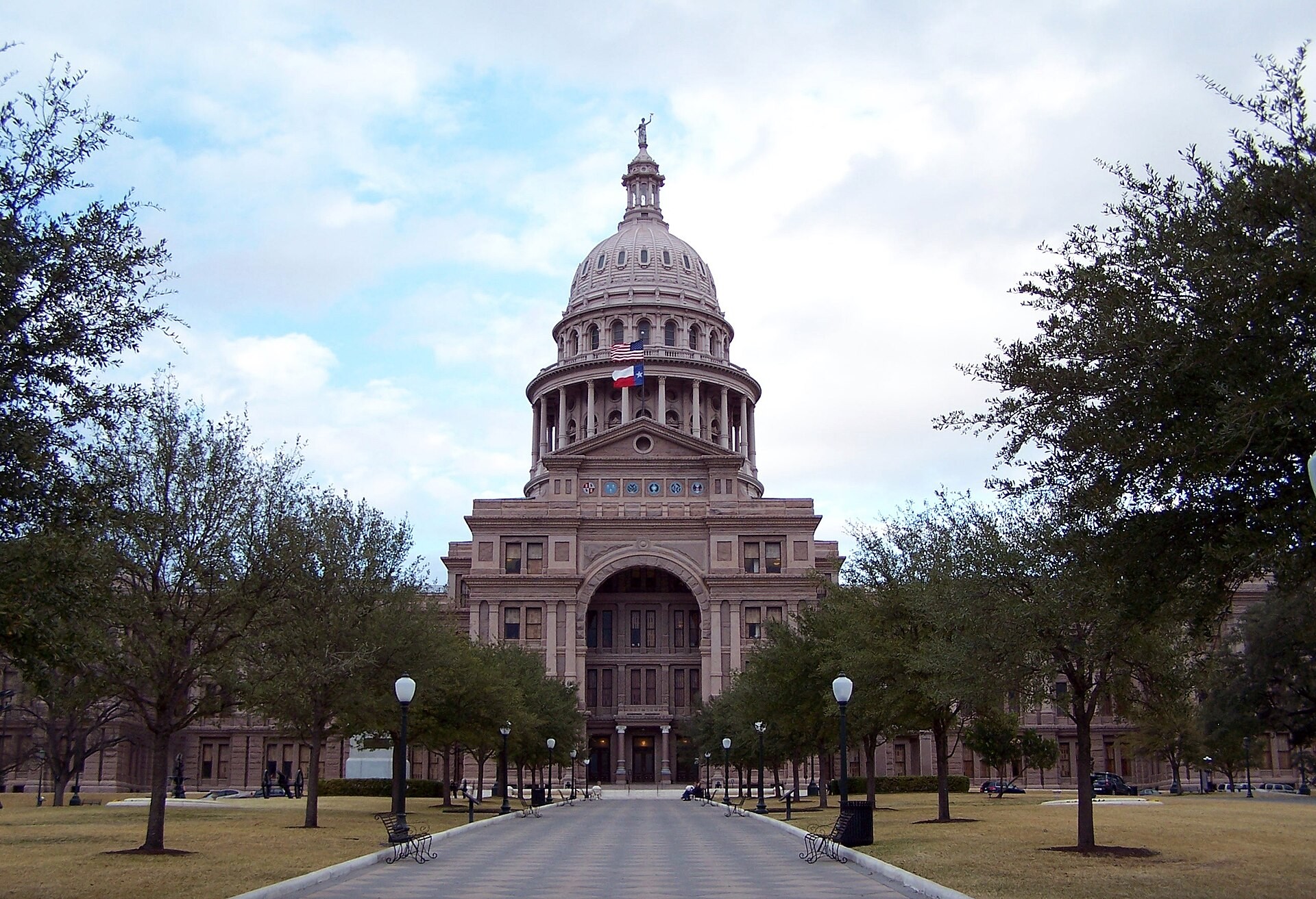 Texas State Capitol with its pink granite dome and lawn in Austin, Texas