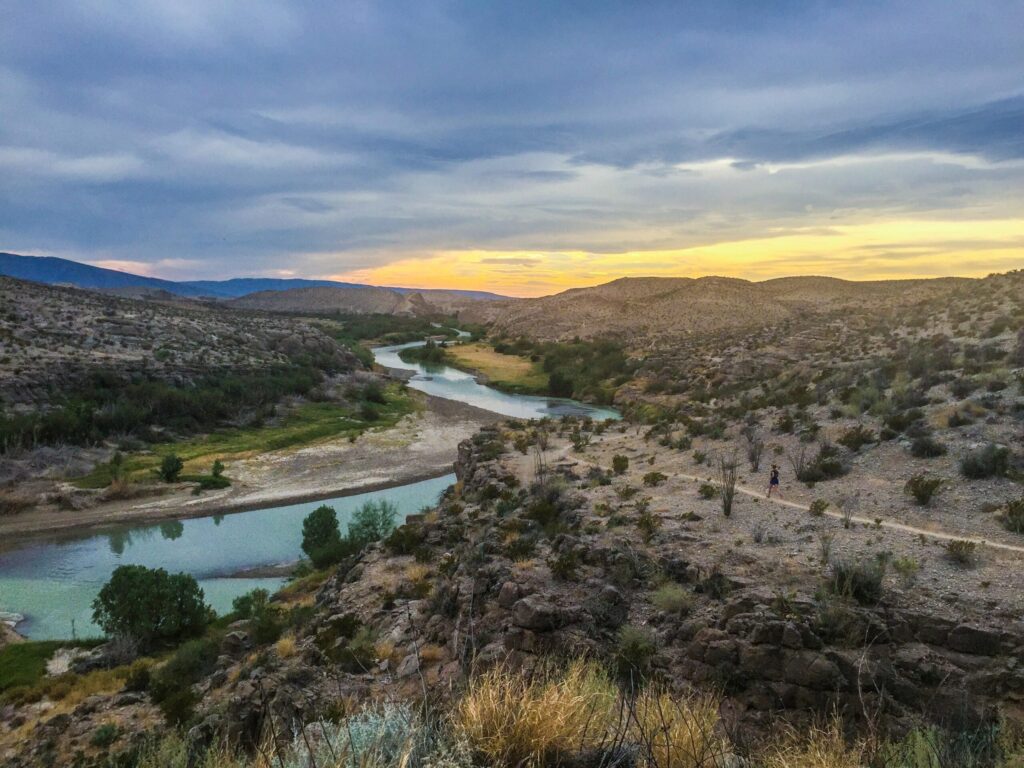 The Rio Grande curving through desert hills at dusk in Big Bend National Park, Texas