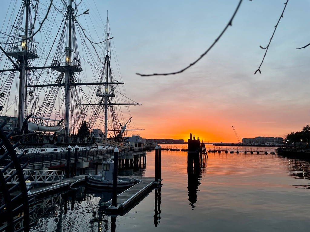 Tall-ship masts and rigging at the Charlestown Navy Yard in Boston at sunset