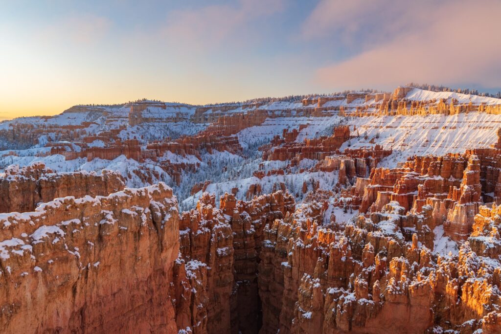 Winter sunrise light on snowy hoodoos below Sunset Point, Bryce Canyon National Park