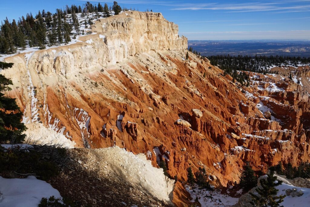 Snow-dusted orange cliff near Yovimpa Point at the end of the Southern Scenic Drive
