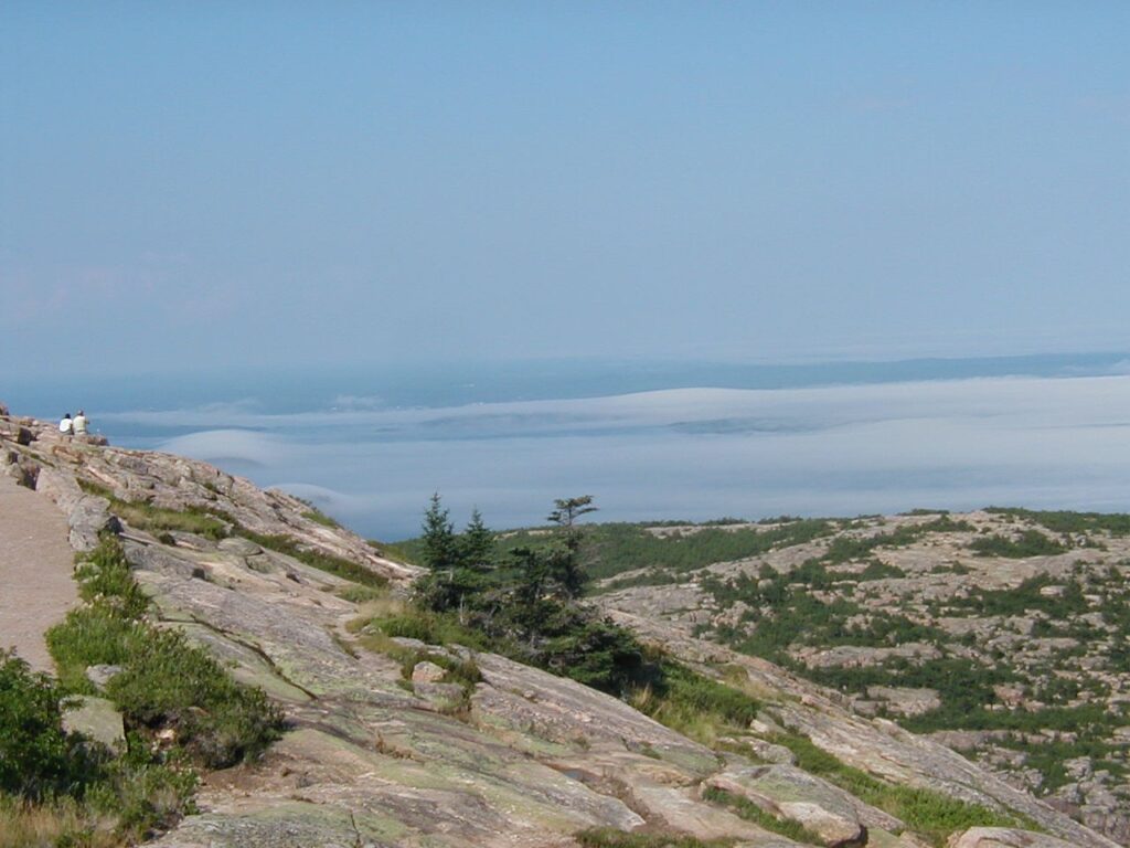 Summer fog filling the valley below Cadillac Mountain on the Acadia All-American Road