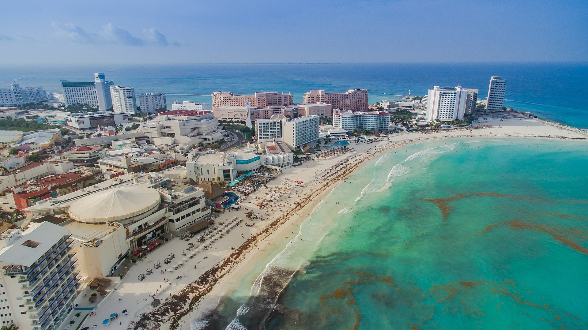 Aerial view of the Cancun Hotel Zone coastline with beach and resorts