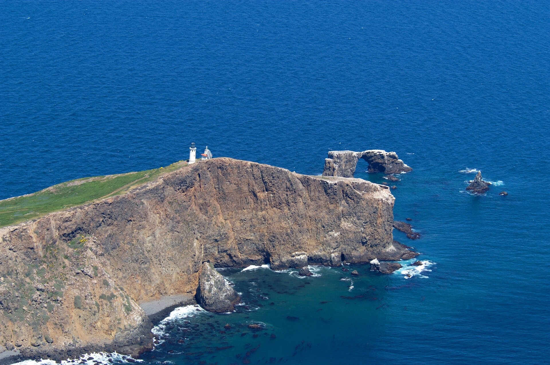 Aerial view of the lighthouse and rock arch on Anacapa Island, Channel Islands National Park