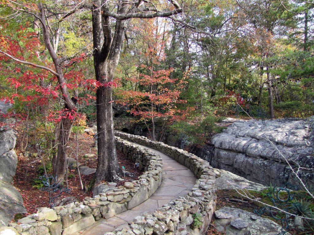 Stone-edged garden path winding past boulders at Rock City on Lookout Mountain