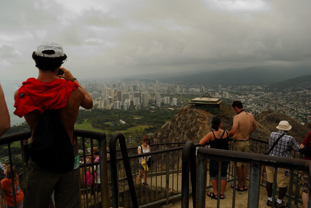 Crowd of hikers at the summit lookout of the Diamond Head trail on Oahu