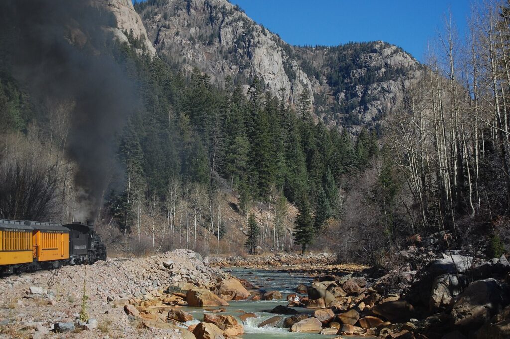Train running beside the Animas River on the way to Silverton, Colorado