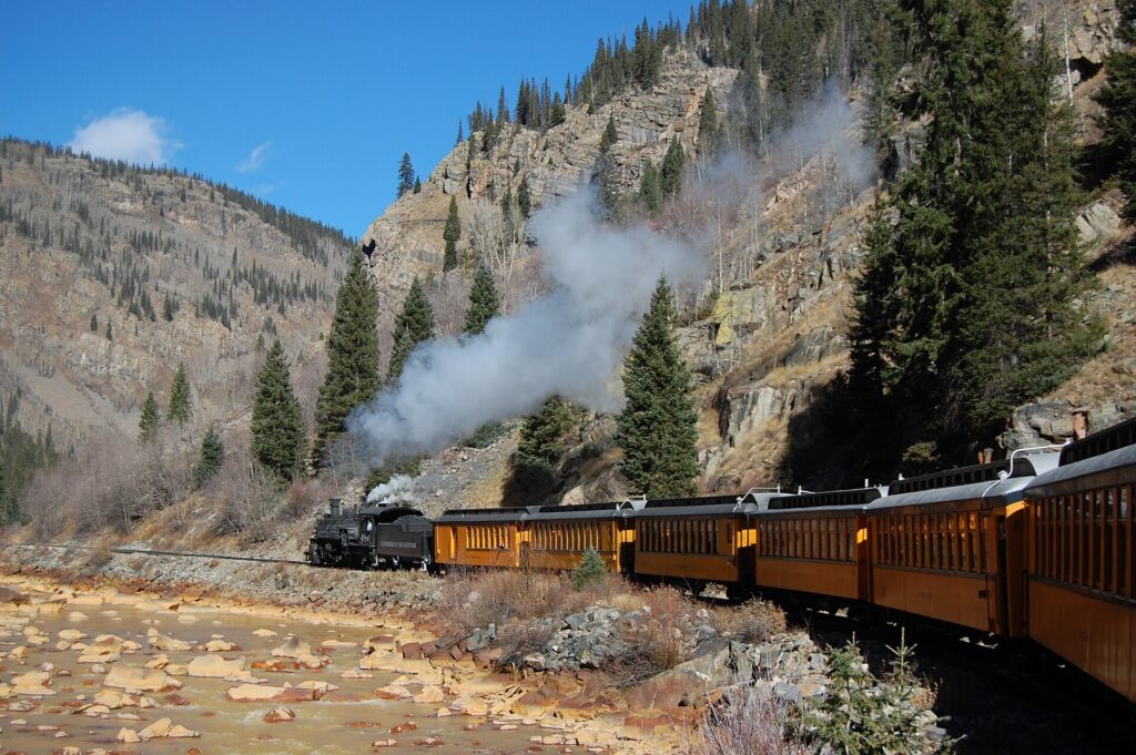Train approaching Silverton, Colorado, with mountains behind
