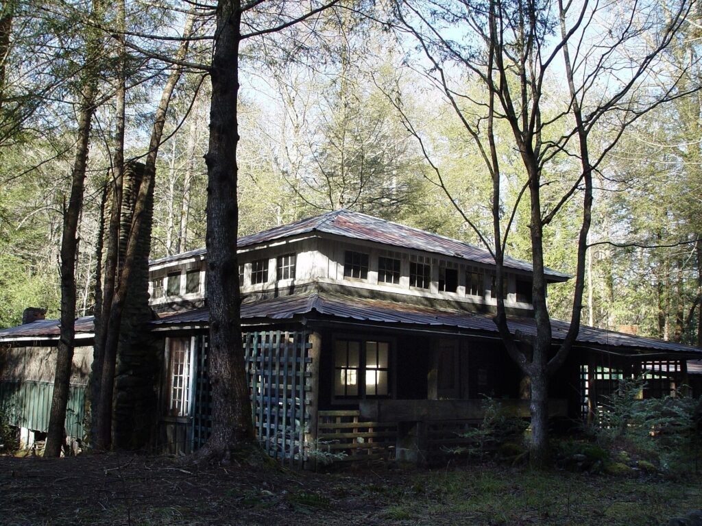 Historic Bauman Cabin among trees in the Elkmont area of Great Smoky Mountains National Park