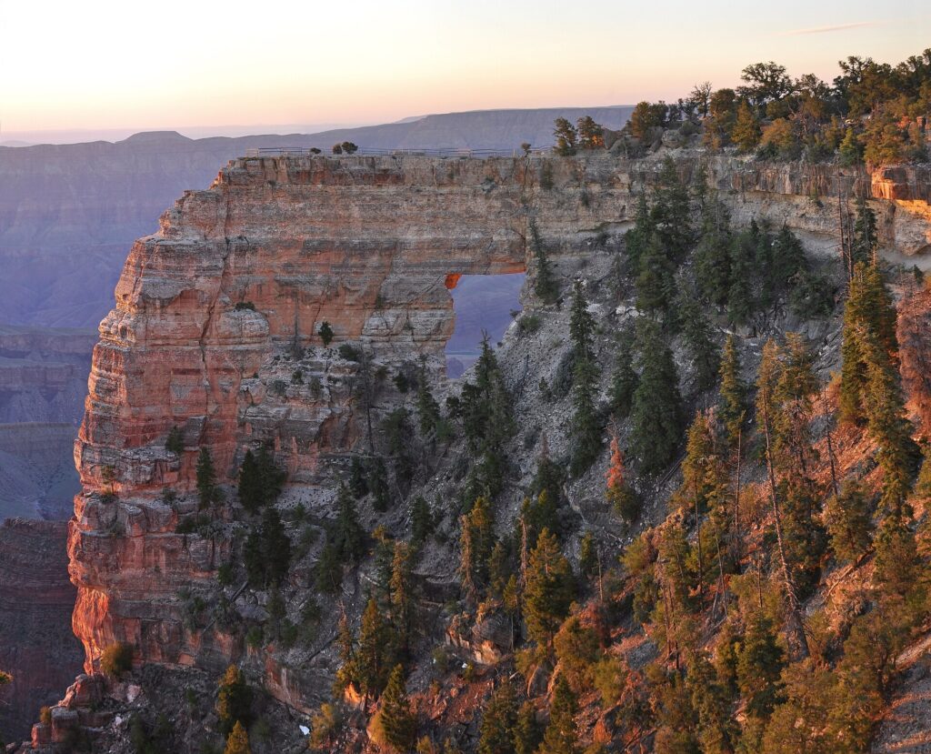 Sunrise light on Angels Window rock opening beside Cape Royal on the Grand Canyon North Rim