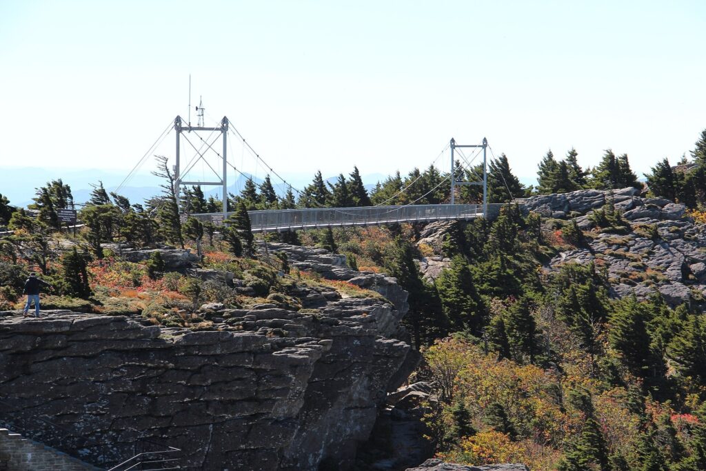 The Mile High Swinging Bridge on Grandfather Mountain in October with mountain ridges behind