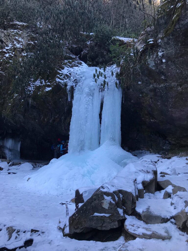 Frozen Grotto Falls with long icicles hanging from the ledge in Great Smoky Mountains National Park