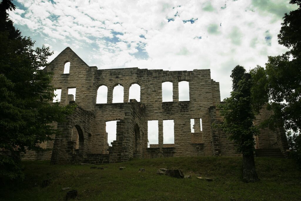 Roofless stone walls and window openings of the Ha Ha Tonka castle ruins at Lake of the Ozarks, Missouri