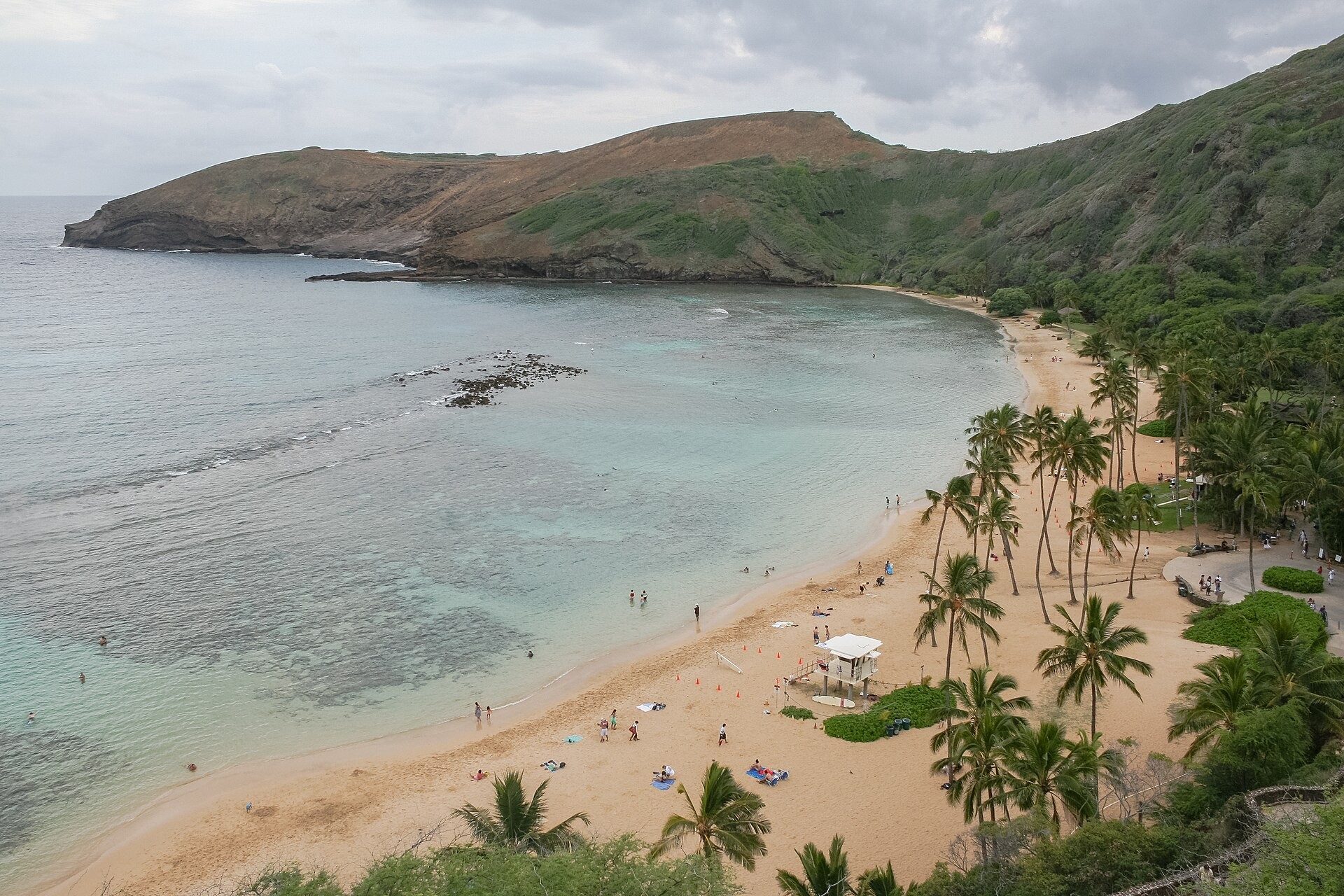 Hanauma Bay on Oahu seen from above with the curved beach and turquoise reef water
