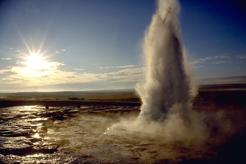 Strokkur geyser erupting a column of water at Geysir geothermal area in Iceland