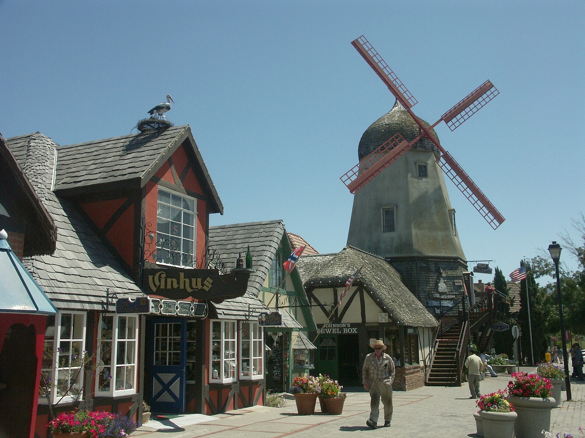 Danish-style windmill and timber-framed shops on a street in Solvang, California