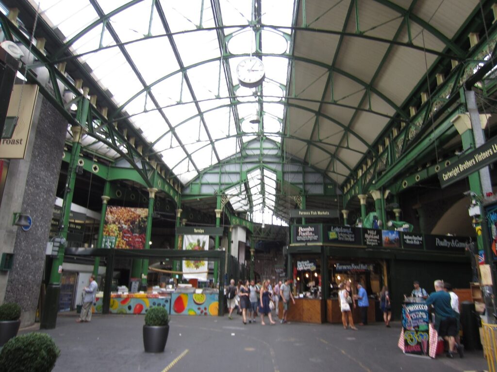 Food stalls and customers at Borough Market, London