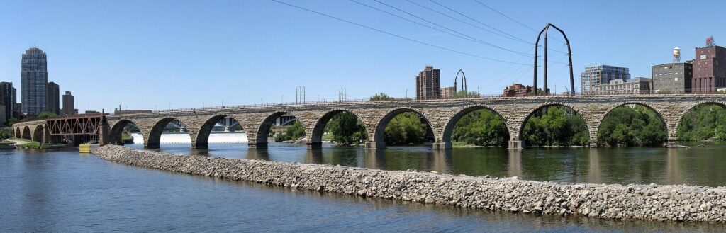 Panoramic view of the Stone Arch Bridge crossing the Mississippi River in Minneapolis