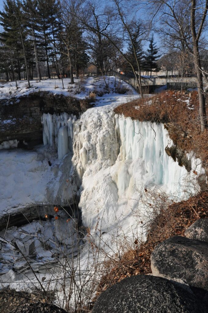 Minnehaha Falls frozen into icicles and ice in winter in Minneapolis