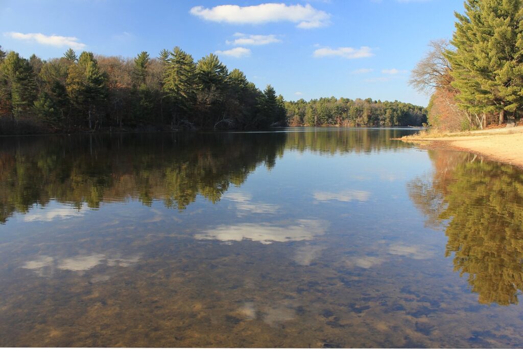 Clouds and landscape reflected in the still water of Mirror Lake State Park