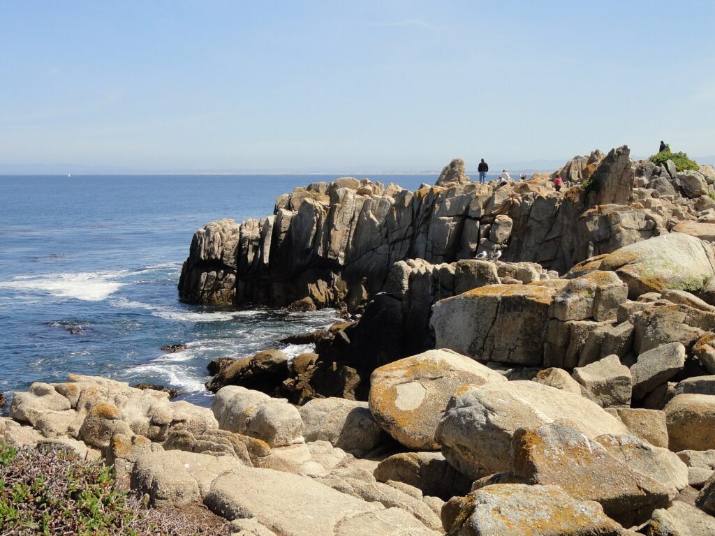 Rocky shoreline and open water at Lovers Point Park in Pacific Grove