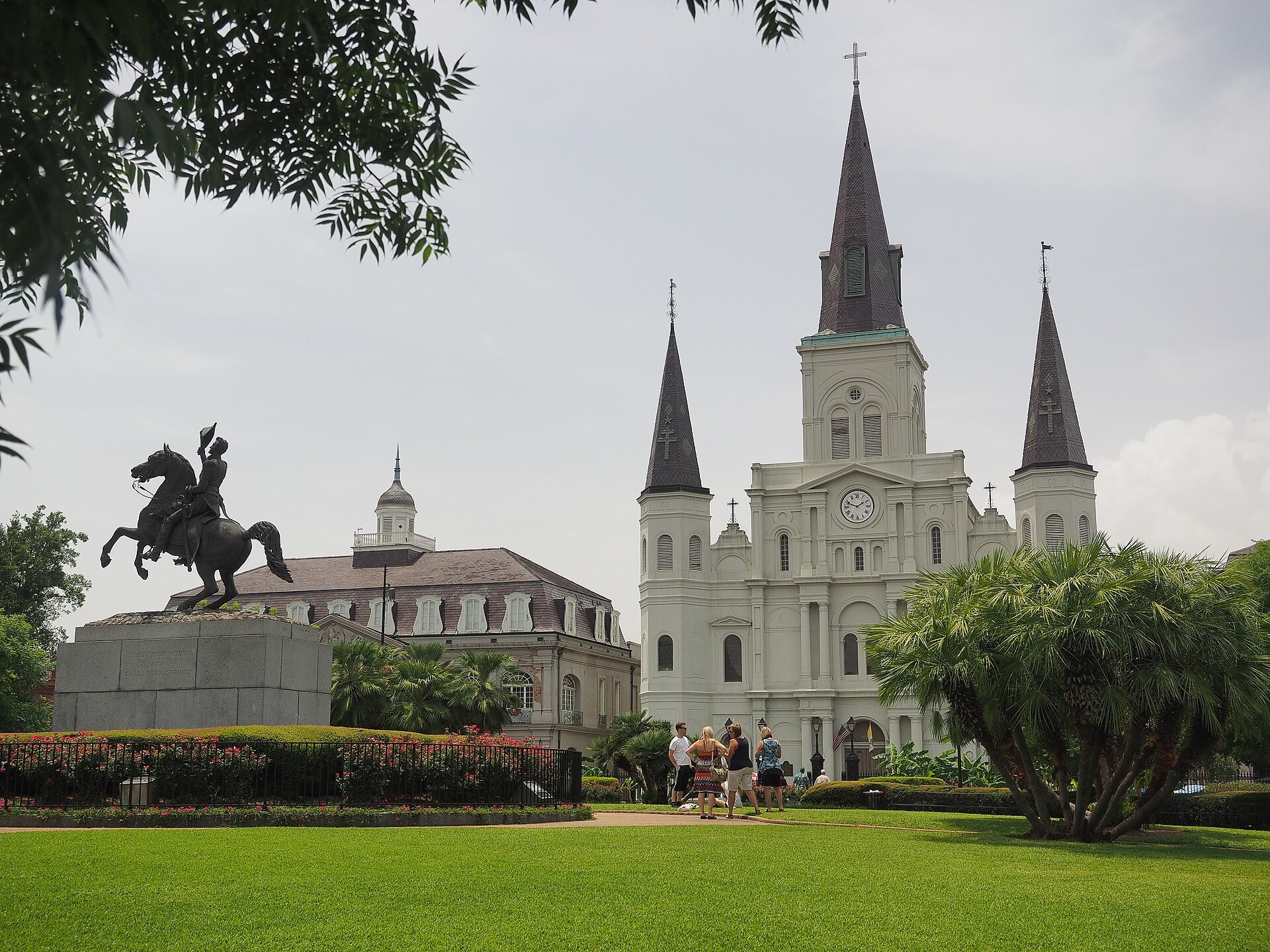 St. Louis Cathedral rising behind the trees of Jackson Square in the French Quarter of New Orleans