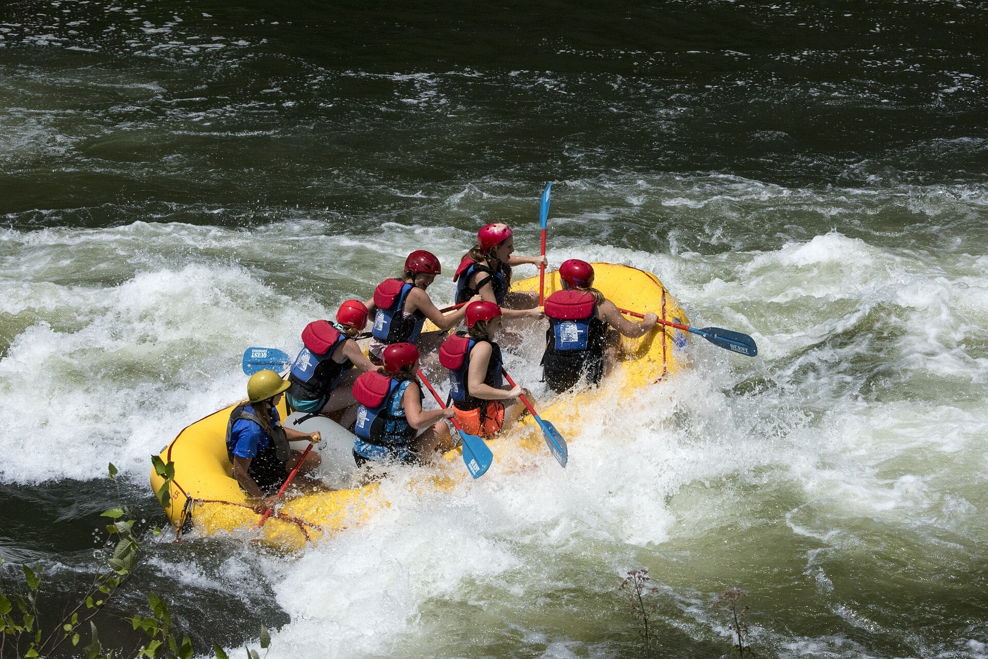Whitewater rafters paddling through rapids on the Ocoee River in the Cherokee National Forest, Tennessee