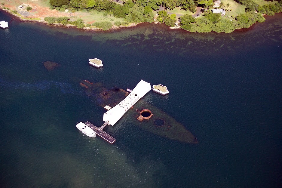 The white USS Arizona Memorial spanning the sunken battleship in Pearl Harbor, Oahu