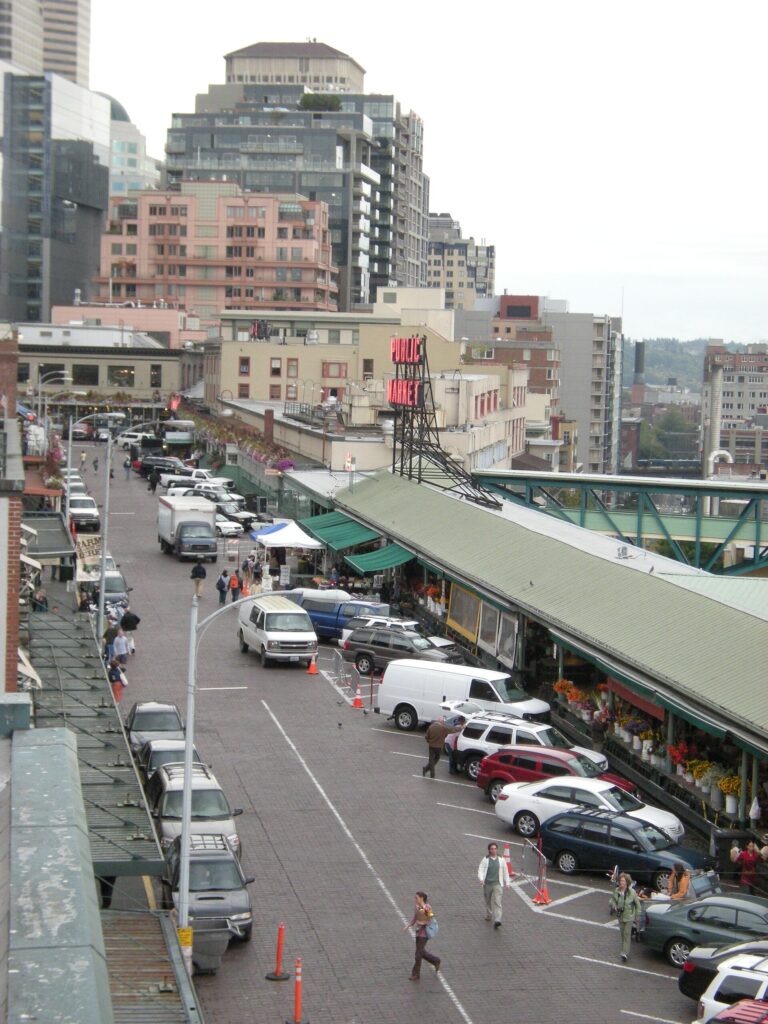 Pike Place, the main street of Pike Place Market in Seattle, with market stalls and signage