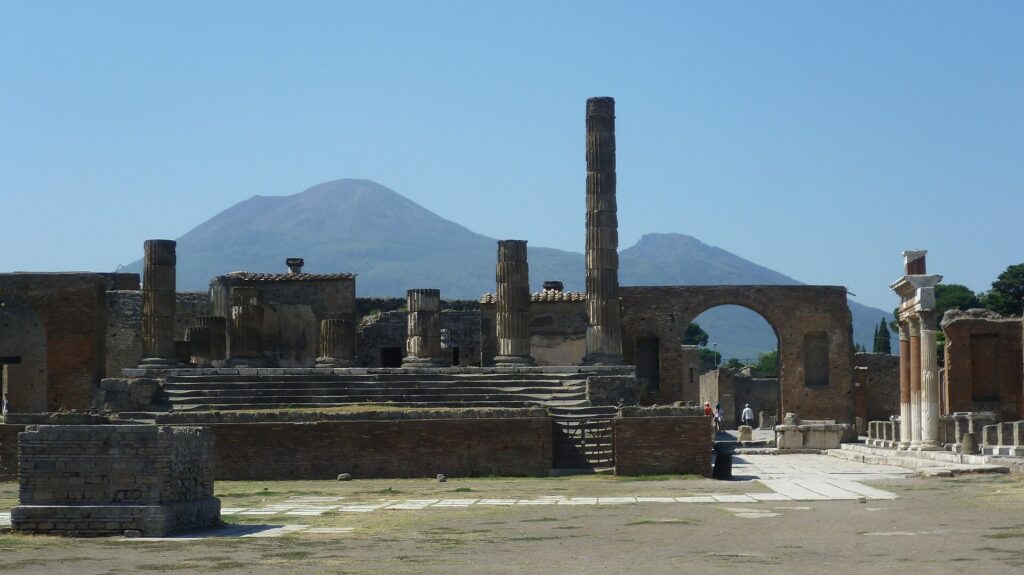Ruins of the Forum at Pompeii with Mount Vesuvius rising behind