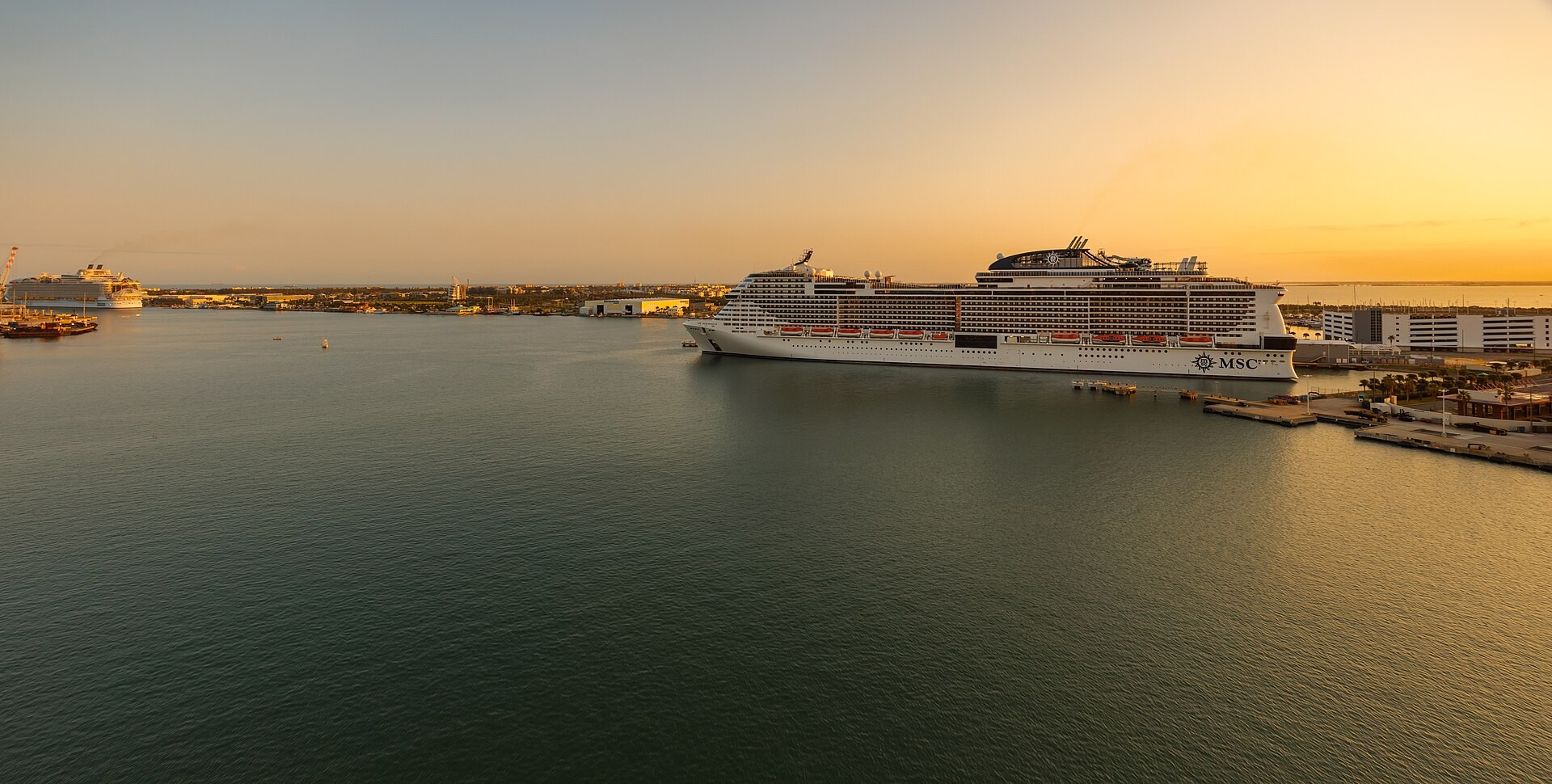 Two large cruise ships docked at Port Canaveral at sunset