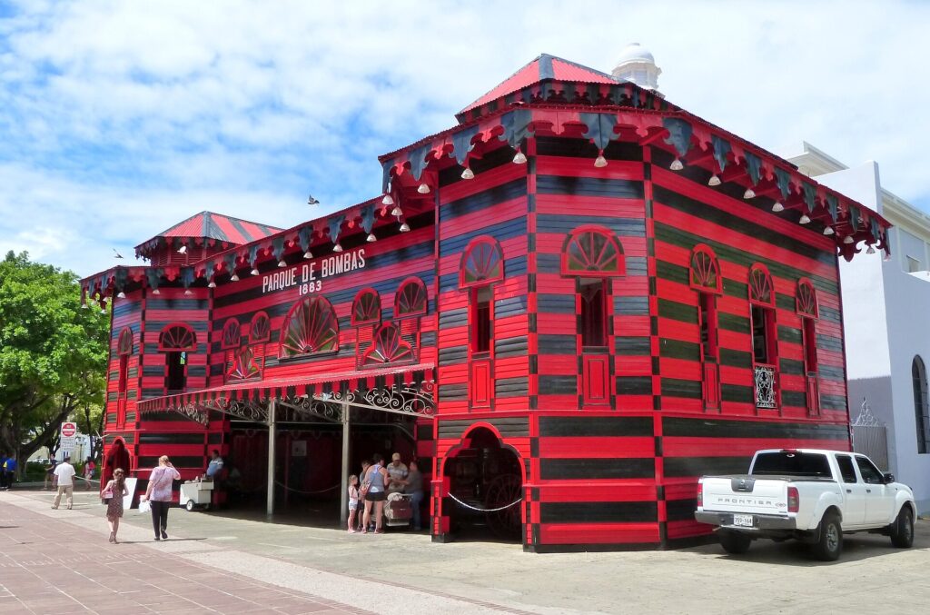 Red and black striped Parque de Bombas fire station beside Plaza Las Delicias in Ponce, Puerto Rico