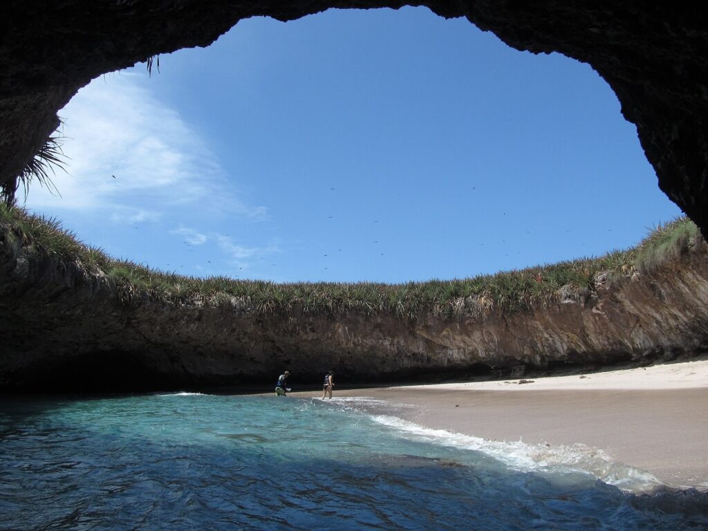 Open-roofed cave and small beach at Hidden Beach in the Marietas Islands