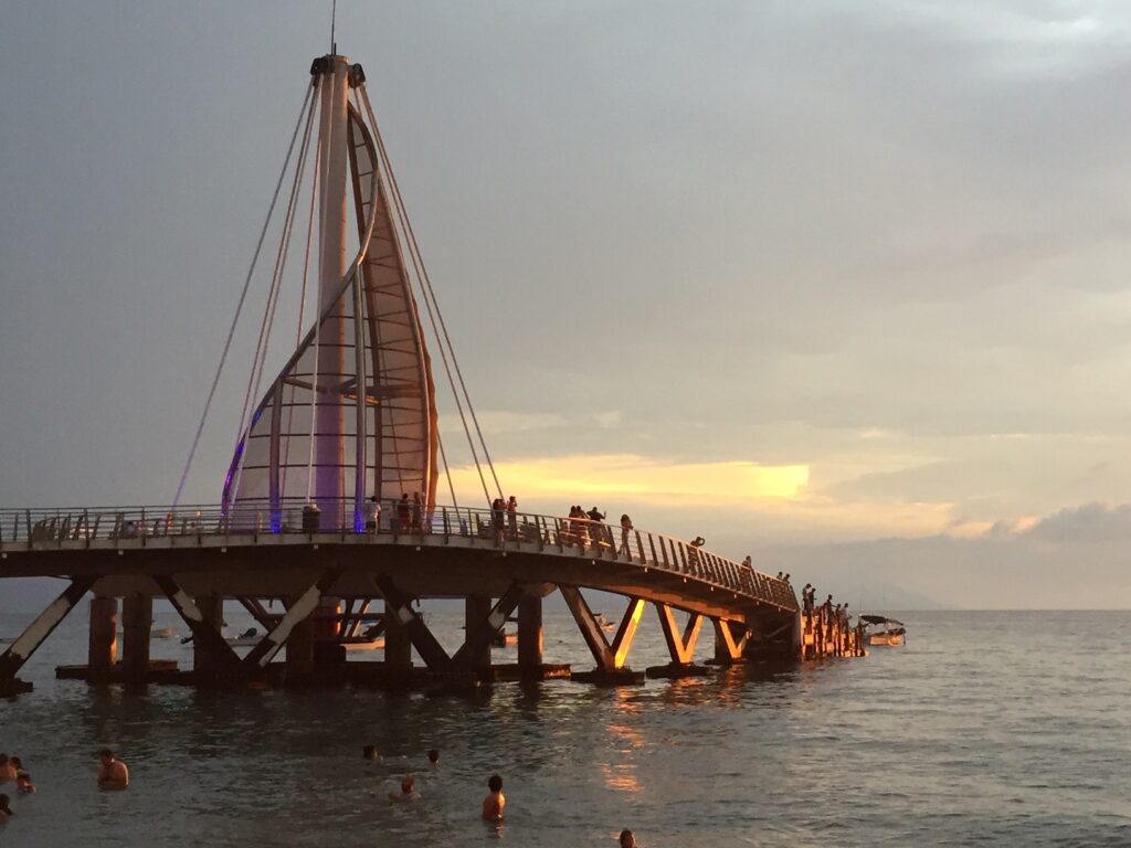 Sail-shaped Los Muertos Pier at sunset in the Zona Romántica of Puerto Vallarta