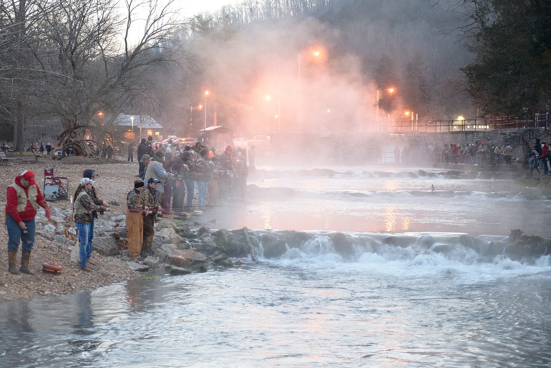 Anglers fishing the Roaring River at Roaring River State Park trout opener, Missouri