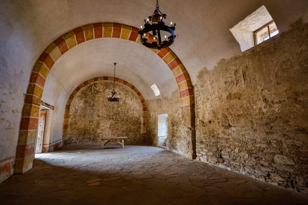 Arched stone room inside the granary at Mission San Jose in San Antonio