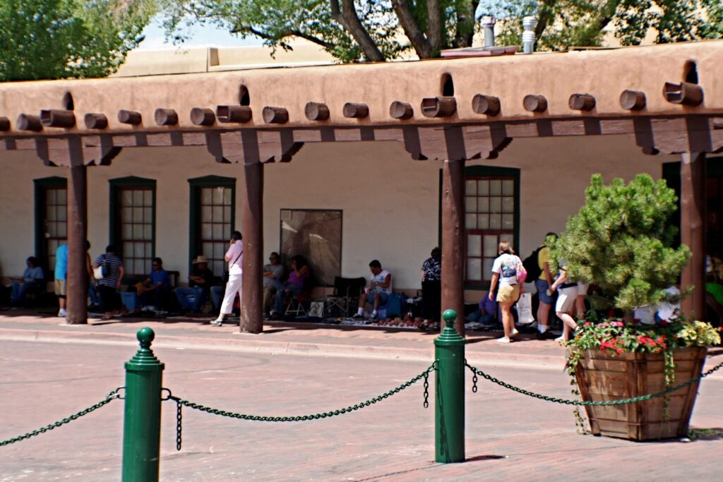 The long wooden-beam portal of the Palace of the Governors facing the Plaza in Santa Fe, New Mexico