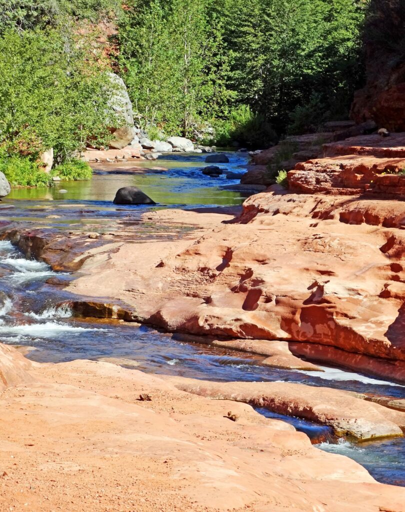 Oak Creek flowing over red rock at Slide Rock State Park in Oak Creek Canyon, Arizona