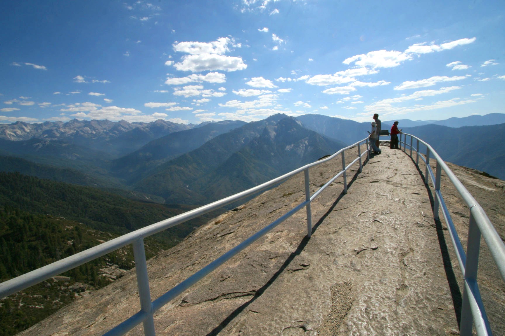 Granite dome of Moro Rock rising above forest in Sequoia National Park, California