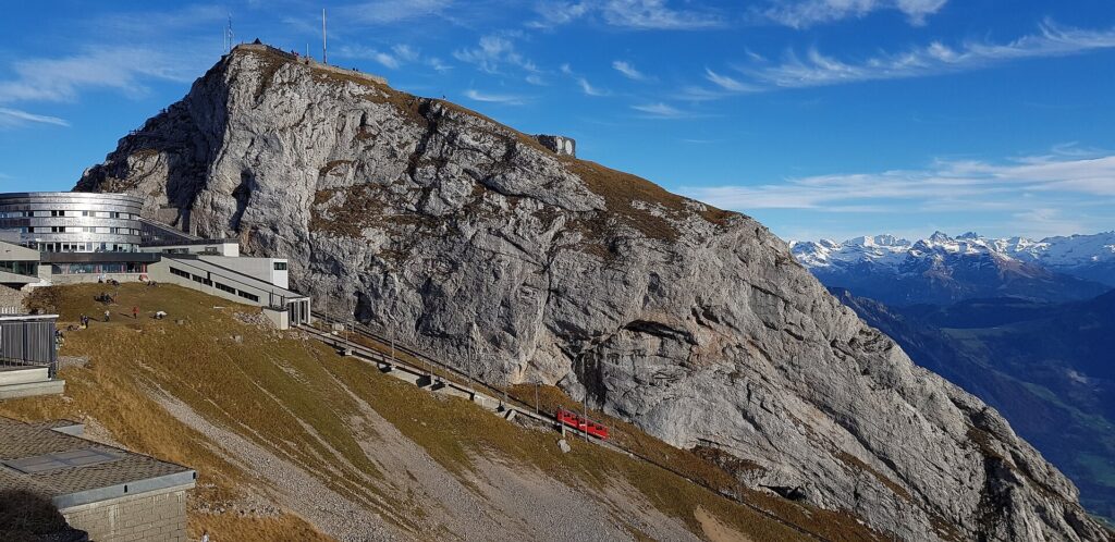 The Pilatus summit ridge with the Kulm station buildings and the cogwheel railway track, Switzerland