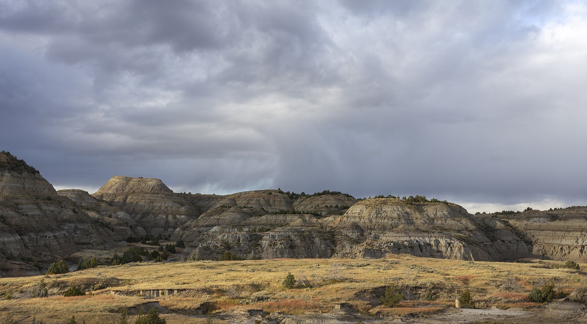 Layered badlands buttes and grassland in the South Unit of Theodore Roosevelt National Park, North Dakota