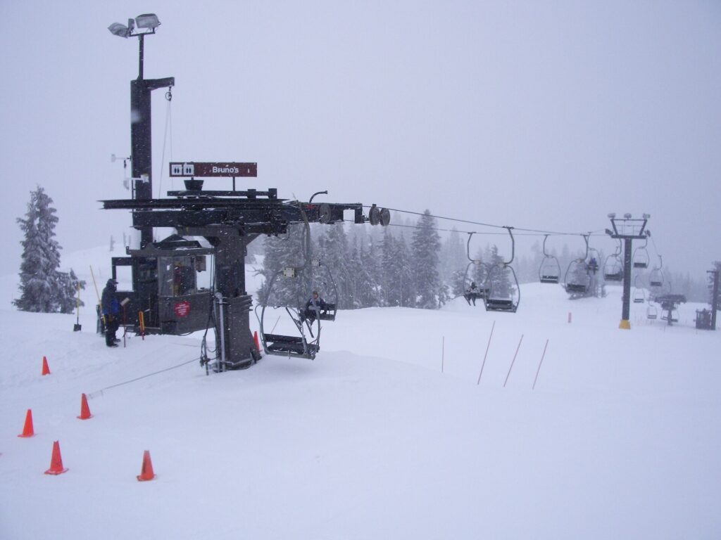A beginner slope with orange cones and a chairlift at Timberline Lodge on Mount Hood, Oregon