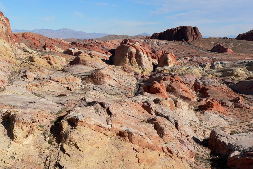 Rocky sandstone terrain and distant hills in the White Domes area of Valley of Fire State Park
