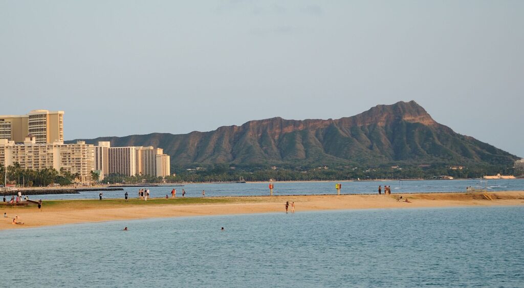 Magic Island Lagoon at Ala Moana Beach Park with Diamond Head and Waikiki hotels in the distance