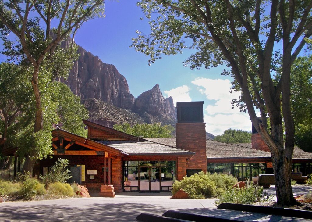 Zion Canyon Visitor Center area with cliffs behind it in Zion National Park, Utah